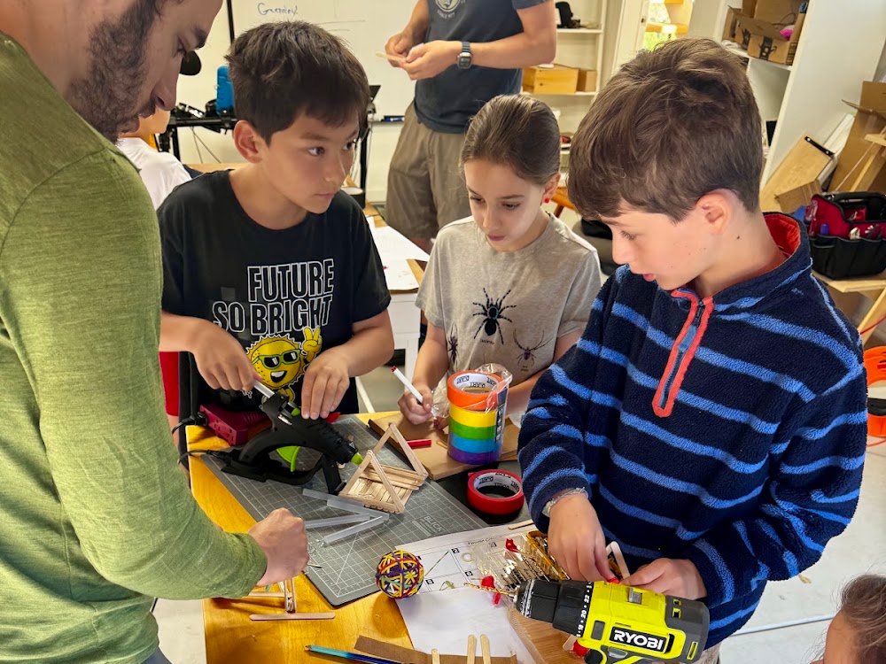 Kids with hand-built catapults, the first Build League session